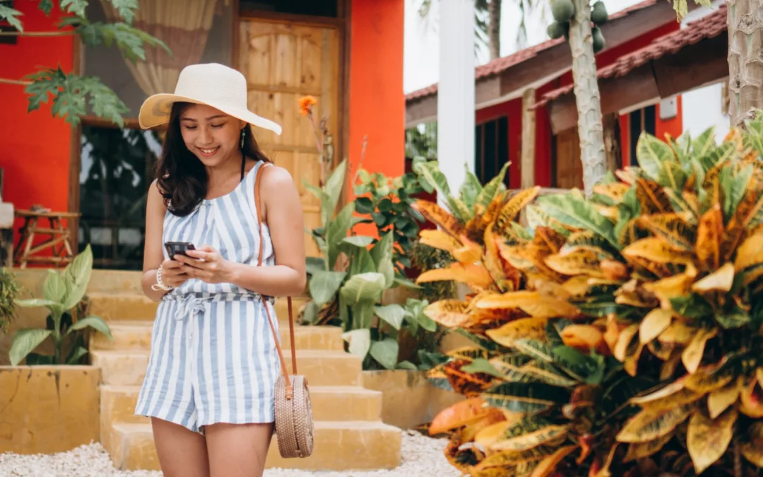 Asian Business Woman On A Vacation Talking On Phone